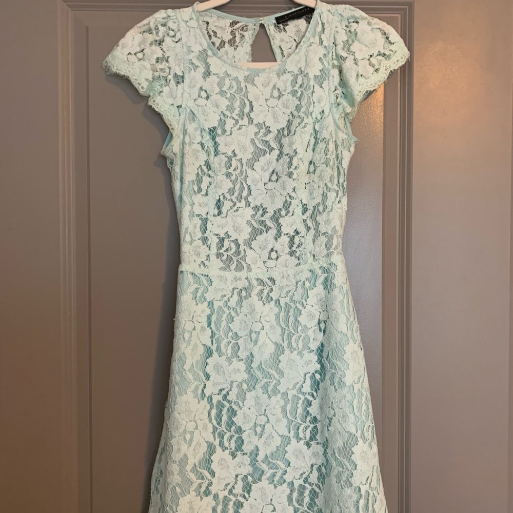 Woman’s size small powder blue lace dress with open back